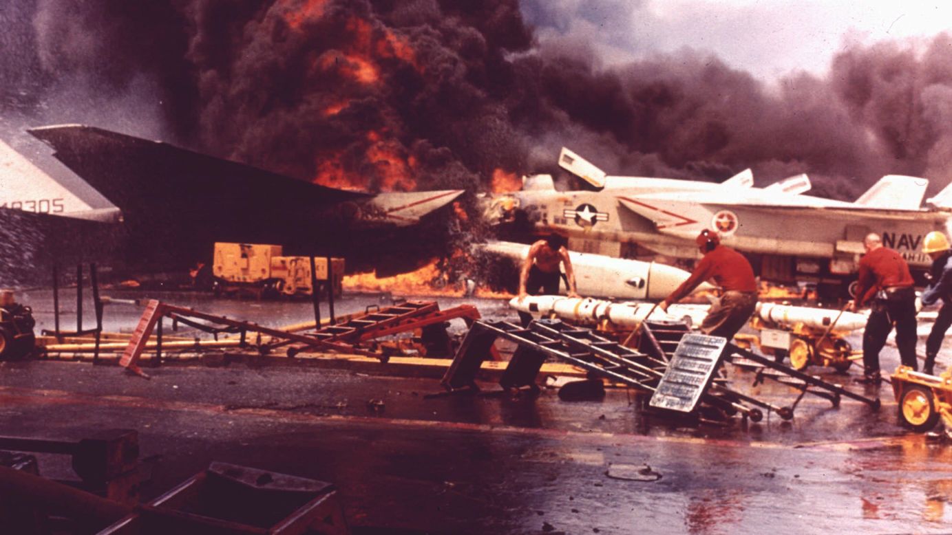 Planes burn aboard the USS Forrestal after a Zuni missile accidentally fired from another aircraft in July 1967. The incident involved then-Lt. Cmdr. John McCain, who ran for his life through the flames, according to Navy accounts. The accident left 134 people dead.