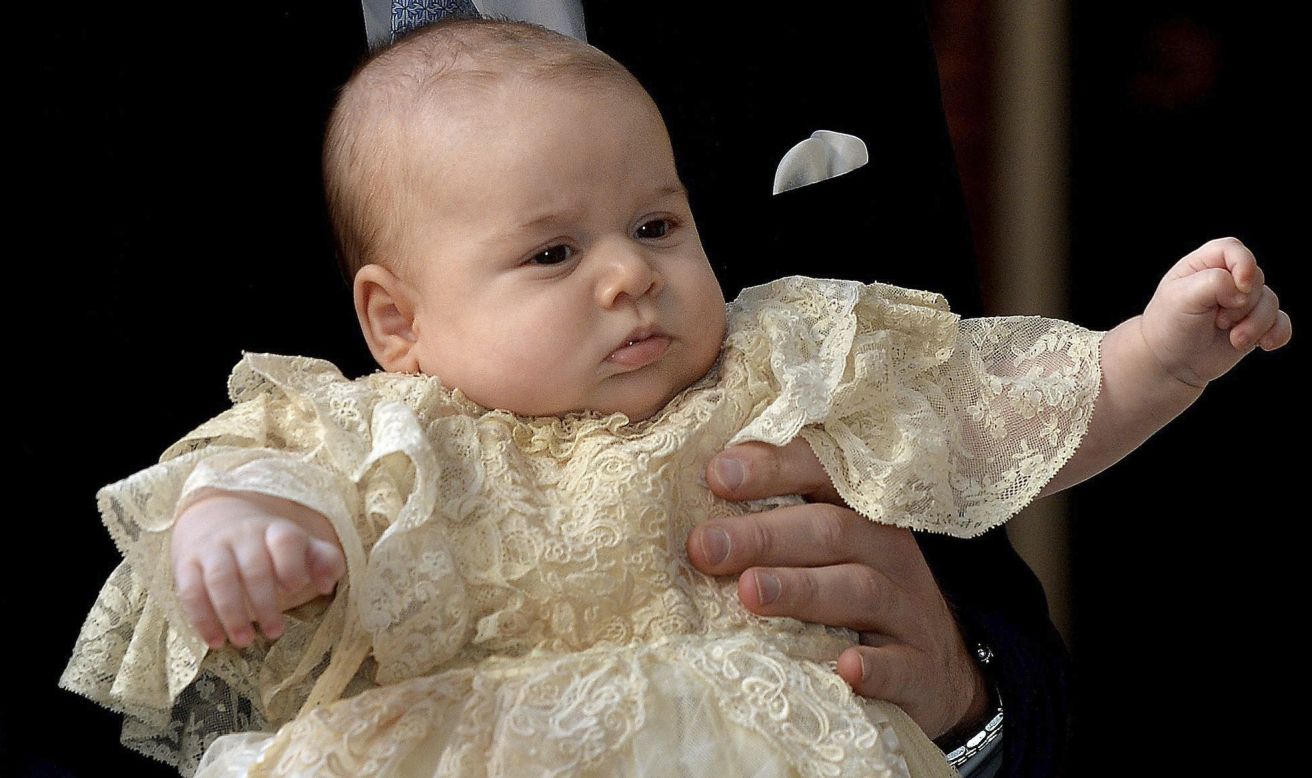 Prince George is wearing an outfit made of delicate Honiton lace and white satin by Angela Kelly, an exact replica of the one worn before him by every baby born to the British Royal family since 1841.
