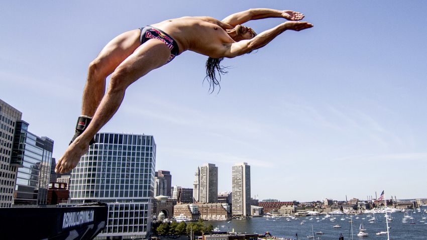  In this handout image provided by Red Bull, Orlando Duque of Colombia dives from the 27.5 metre platform on the ICA building at Fan Pier during the fifth stop of the Red Bull Cliff Diving World Series on August 25, 2013 in Boston, Massachusetts. (Photo by Dean Treml/Red Bull via Getty Images