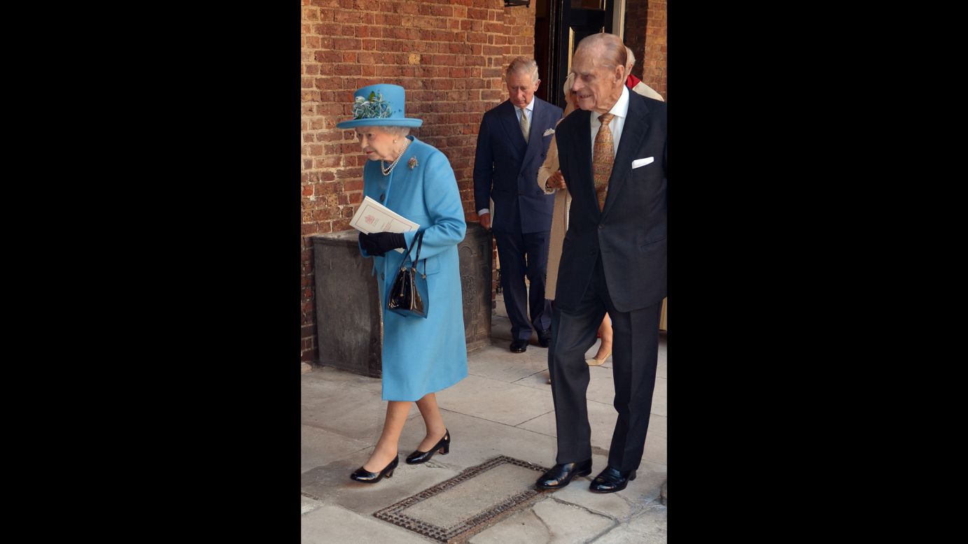 Queen Elizabeth II and Prince Philip, followed by Prince Charles, leave the Chapel Royal following the christening of the Queen's great-grandson.
