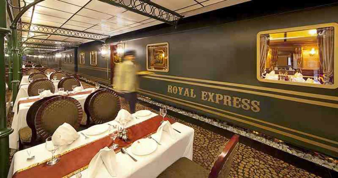 Royal Express has waiters in porter uniforms and regular platform announcements in Hindi.