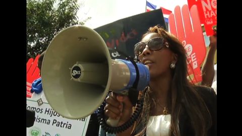 Dominicans of Haitian descent protest against a court ruling that could strip them of their citizenship