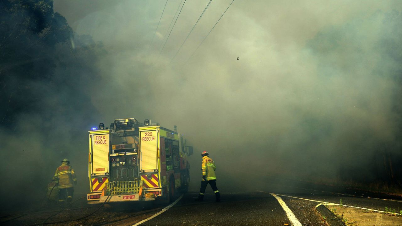 Firefighters battle the front line in Lake Macquarie on October 23.