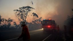 New South Wales Rural Fire Service crew members fight a fire near Mount Wilson in the Blue Mountains of Australia on Thursday, October 24.
