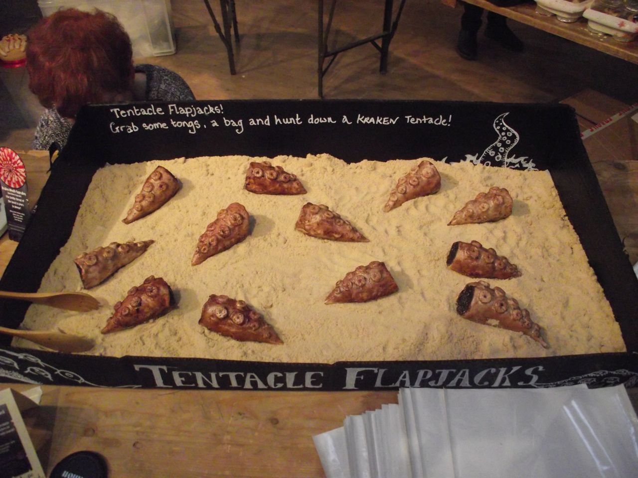Tentacle flapjacks, covered with the finest white chocolate, made by <a href="https://www.facebook.com/HeartacheCakes" target="_blank" target="_blank">Heartache Cakes</a>.