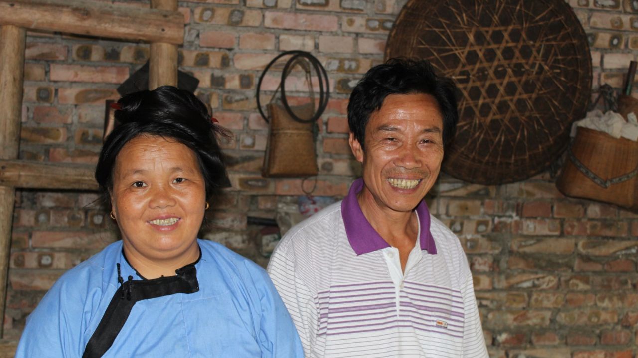 Teacher Shi, right, and his wife fear their language may be disappearing