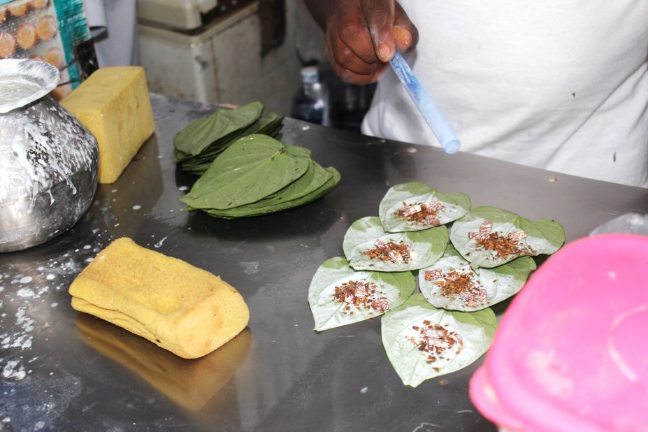 More lime is flicked onto the leaves before they're ready for wrapping.