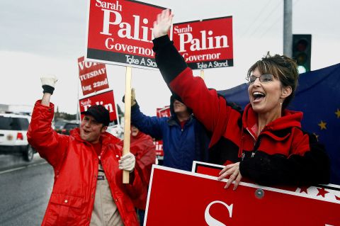 Palin stands in the rain in Anchorage in August 2006 as she campaigns for the Republican gubernatorial nomination. Palin defeated incumbent Frank Murkowski and former state legislator John Binkley.