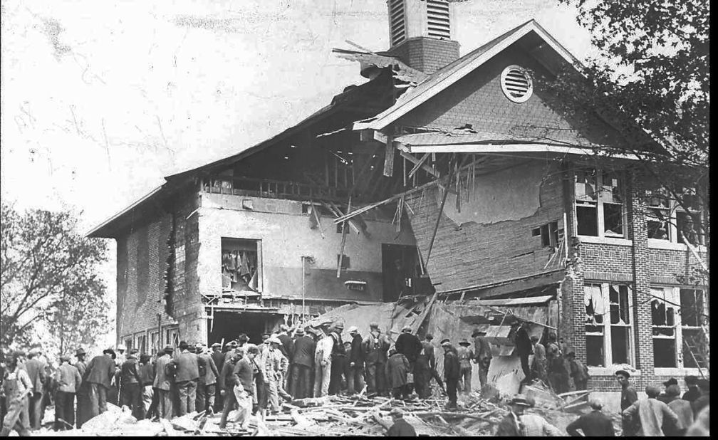 In May 1927, Bath, Michigan, school board member Andrew Kehoe exploded dynamite in the community's school, killing dozens of children and several adults. Here, residents searched for survivors.