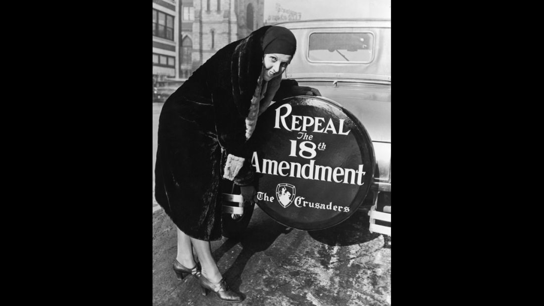 Prohibition might have been at its peak in 1927, although it would not be repealed until 1933. Pictured here in 1927, a woman shows off a sign on the wheel on the back of her car that urges the repeal of the 18th Amendment.
