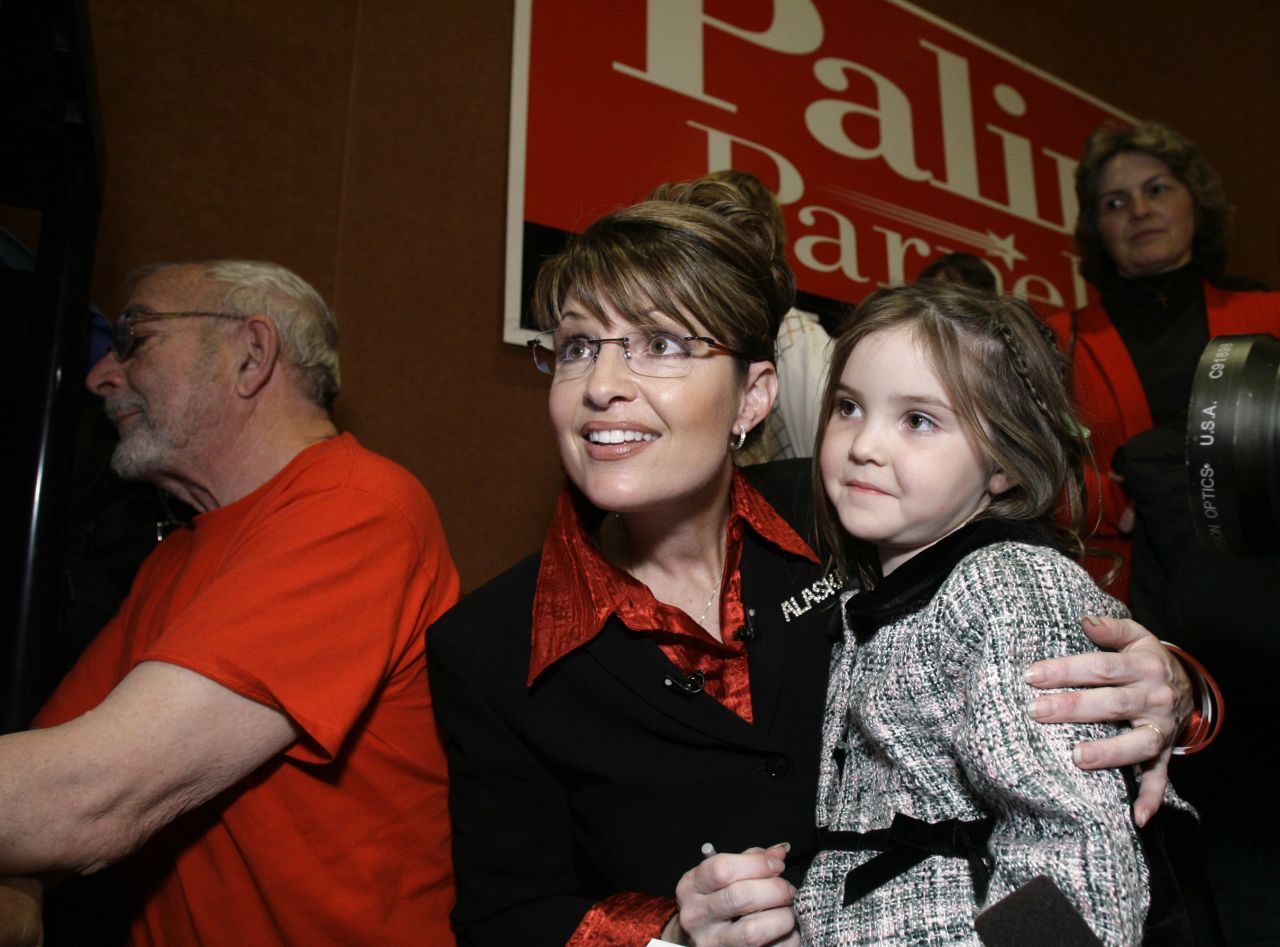 Palin holds her daughter Piper as she watches results on election night in November 2006. The former mayor of Wasilla became Alaska's first female governor.