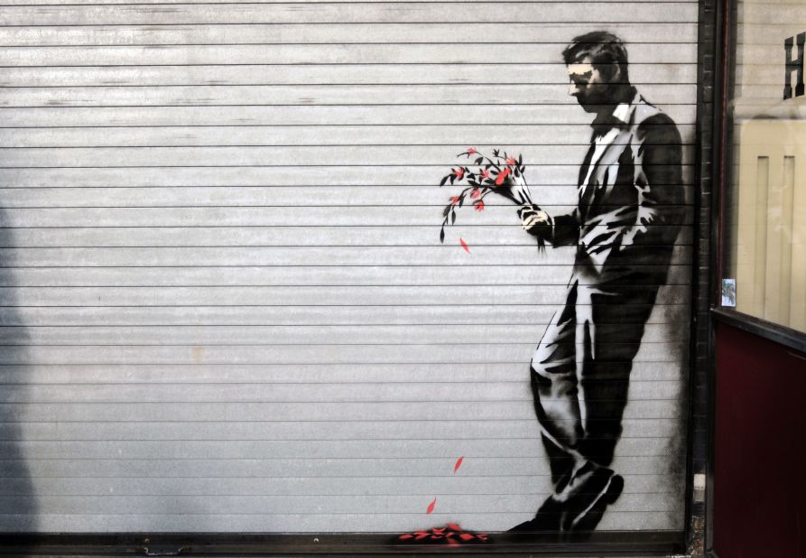 A Banksy piece covers the main entrance to Larry Flynt's Hustler Club in New York's Hell's Kitchen in October 2013.