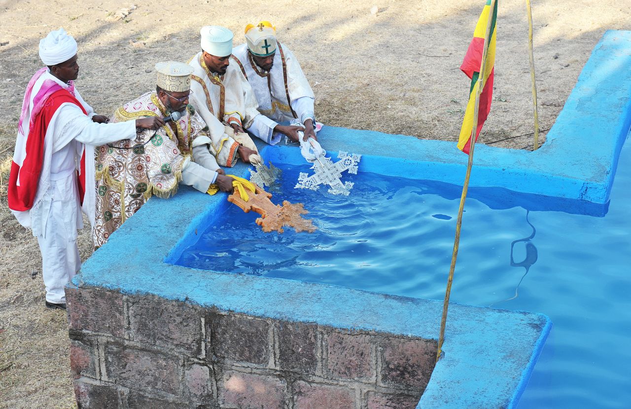 Priests bless the water at the bath. "After the priest has blessed the water, everyone jumps in," says Lonely Planet author Stuart Butler.