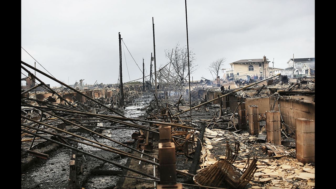 Debris and destroyed homes line a street in the  Breezy Point neighborhood of Queens, New York, on October 30, 2012.