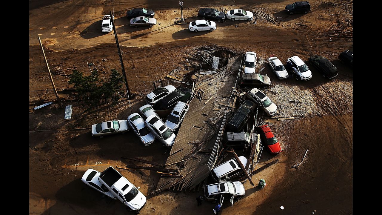 Abandoned and flooded cars are scattered in the Rockaway neighborhood of Queens on November 2, 2012.