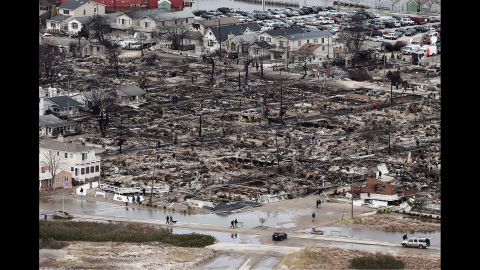 The remains of burned homes are surrounded by water in the Breezy Point neighborhood of Queens on October 31, 2012. 
