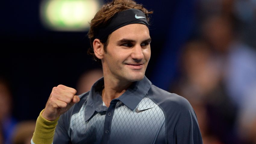 Swiss Roger Federer celebrates his victory against Bulgaria's Grigor Dimitrov during their quarter-final tennis match at the Swiss Indoors ATP tournament in Basel on October 25, 2013. AFP PHOTO / FABRICE COFFRINI (Photo credit should read FABRICE COFFRINI/AFP/Getty Images