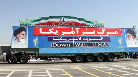 A military truck with a banner against the USA during an annual military parade which marks Iran's eight-year war with Iraq, 1980-88, in the capital Tehran, on September 22, 2013. 