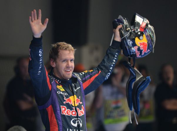 Sebastian Vettel celebrates victory at the Indian Grand Prix in October. The win clinched a fourth straight F1 world title.