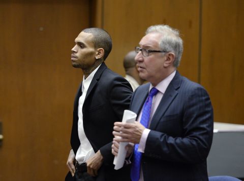 Brown, left, appears in court with his attorney Mark Geragos for a probation violation hearing in Los Angeles on August 16.