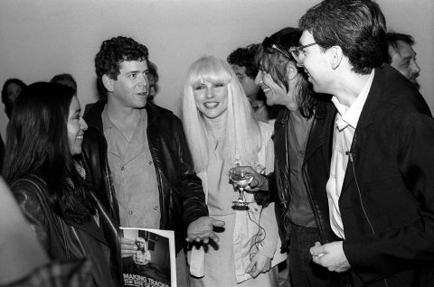 Reed, Debbie Harry of Blondie, center, and Iggy Pop, second from right, attend a party for a book on Blondie in New York on May 4, 1982.