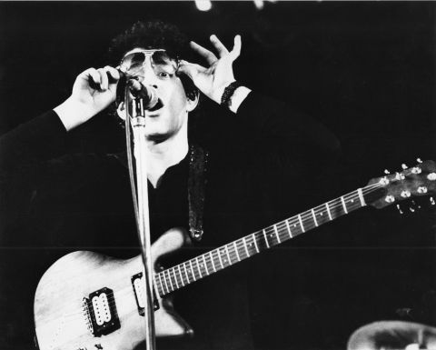 Reed performs live on stage in Amsterdam, in April 1977.