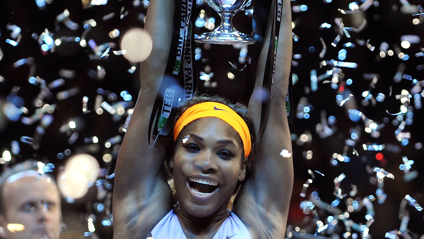 A relieved Serena Williams lifts the WTA Championship title aloft after beating Li Na in a three set final.