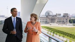 BERLIN, GERMANY - JUNE 19: In this handout photo provided by the German Government Press Office (BPA), U.S. President Barack Obama (L) and German Chancellor Angela Merkel chat prior to a lunch at the terrace of the Chancellery on June 19, 2013 in Berlin, Germany. Obama is visiting Berlin for the first time during his presidency and his speech at the Brandenburg Gate is to be the highlight. Obama will be speaking close to the 50th anniversary of the historic speech by then U.S. President John F. Kennedy in Berlin in 1963, during which he proclaimed the famous sentence: Ich bin ein Berliner.