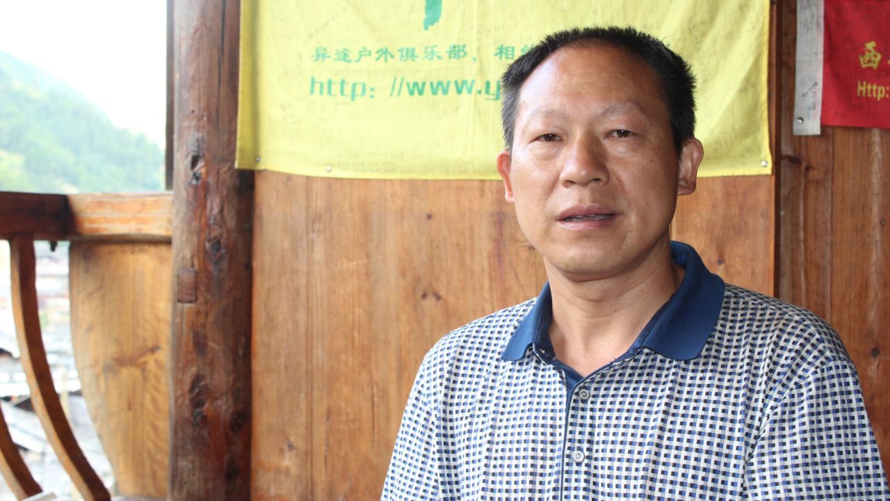 Tang Cheng, a Miao village chief, says tourists don't appreciate his culture