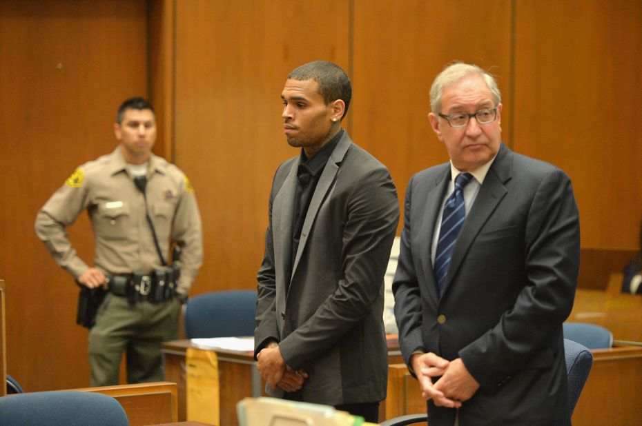 <strong>July 2013:</strong> <a href="http://www.cnn.com/2013/08/15/showbiz/chris-brown-court/index.html">Brown's probation was revoked July 15</a> after he was accused of hit-and-run driving and driving without a license. A woman told investigators Brown "went ballistic" after a traffic accident and screamed at her. The charges were dropped after Brown reached a "civil compromise" with his accuser a month later. Here, he appears in court with his attorney, Mark Geragos.
