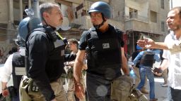 United Nations (UN) arms experts arrive to inspect a site suspected of being hit by a deadly chemical weapons attack last week on August 28, 2013 in the Eastern Ghouta area on the northeastern outskirts of Damascus.