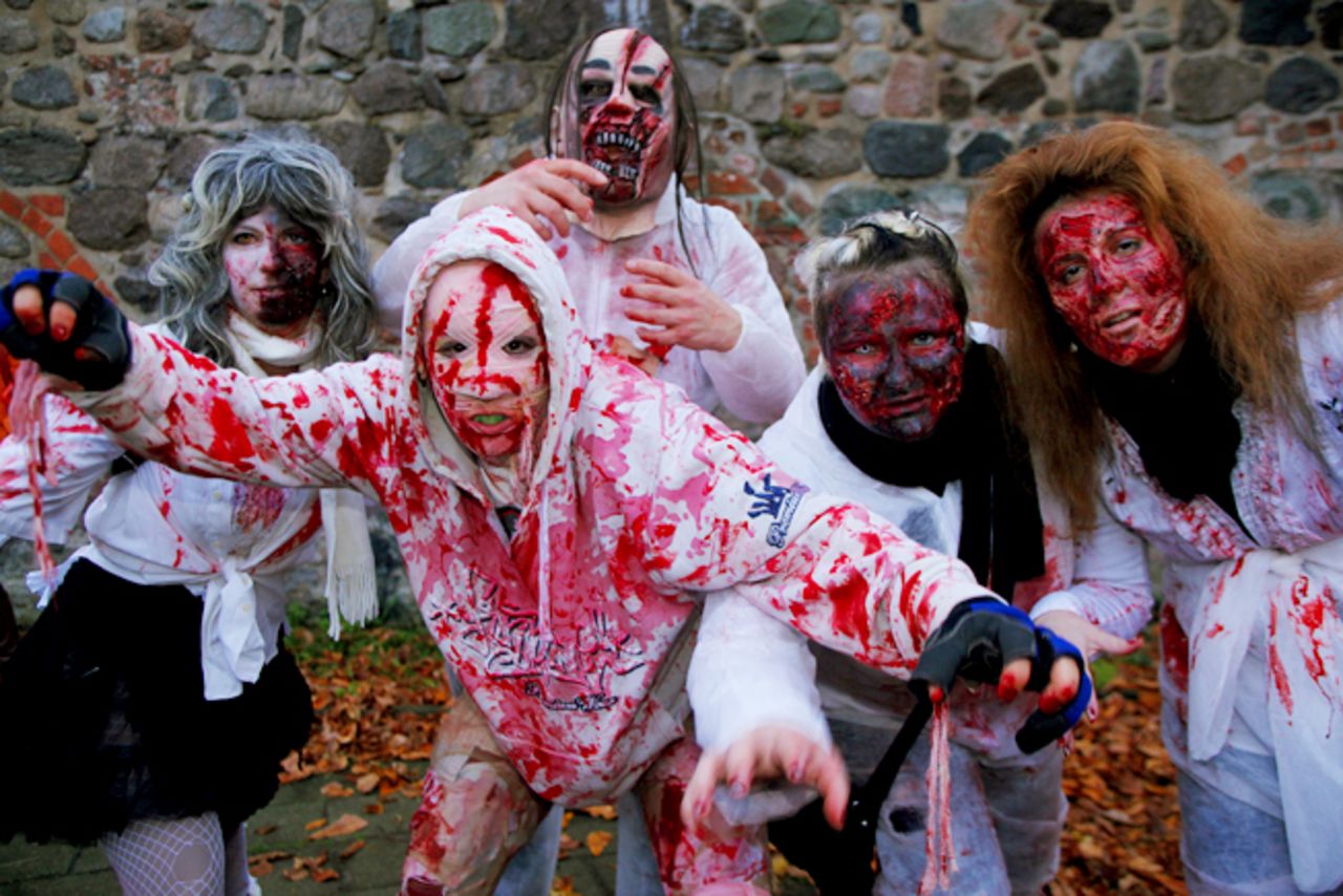 People dress up as zombies as part of the annual Zombie Walk in Berlin, Germany, on October 26, 2013. This walk traditionally occurs the last weekend before Halloween.