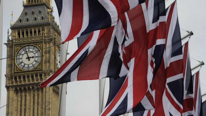 British Union Jack flags flutter in the wind next to Big Ben, in London, on April 28, 2011.