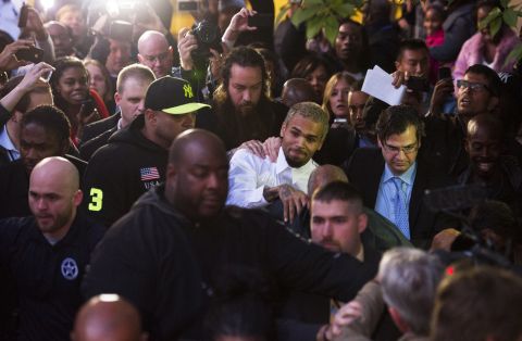 <strong>October 2013:</strong> <a href="http://www.cnn.com/2013/10/28/showbiz/chris-brown-assault-charge/index.html">Brown and a bodyguard were accused of assaulting a man</a> on a Washington sidewalk on October 27. The man told police he tried to jump into a photo that Brown was posing for with a female fan when the singer said, "I'm not down with that gay s--t" and "I feel like boxing."  Isaac Adams Parker said Brown punched him in the face, the police report said. Brown was released from jail the next day.