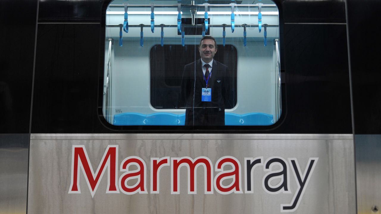 A Turkish train driver stands at a Marmaray station ahead of the inauguration ceremony. The Marmaray name combines the Sea of Marmara with "ray," which means rail in Turkish.