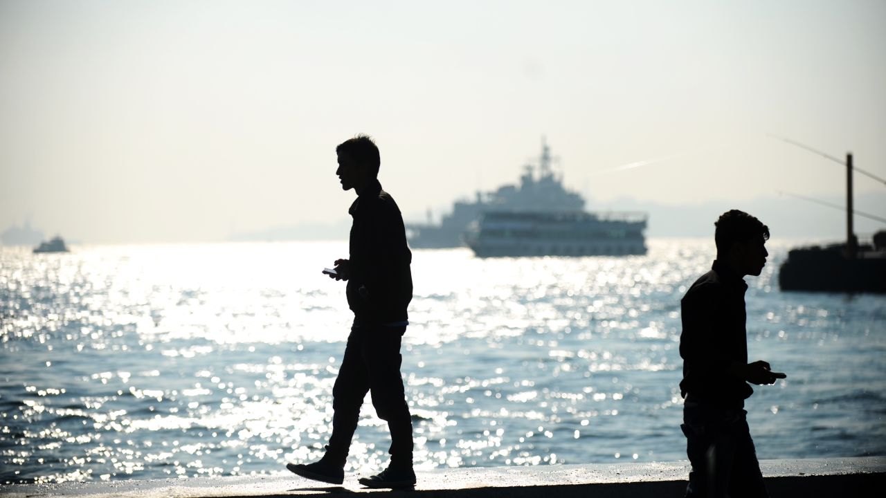 A man stands near the Bosphorus on Monday in Istanbul.