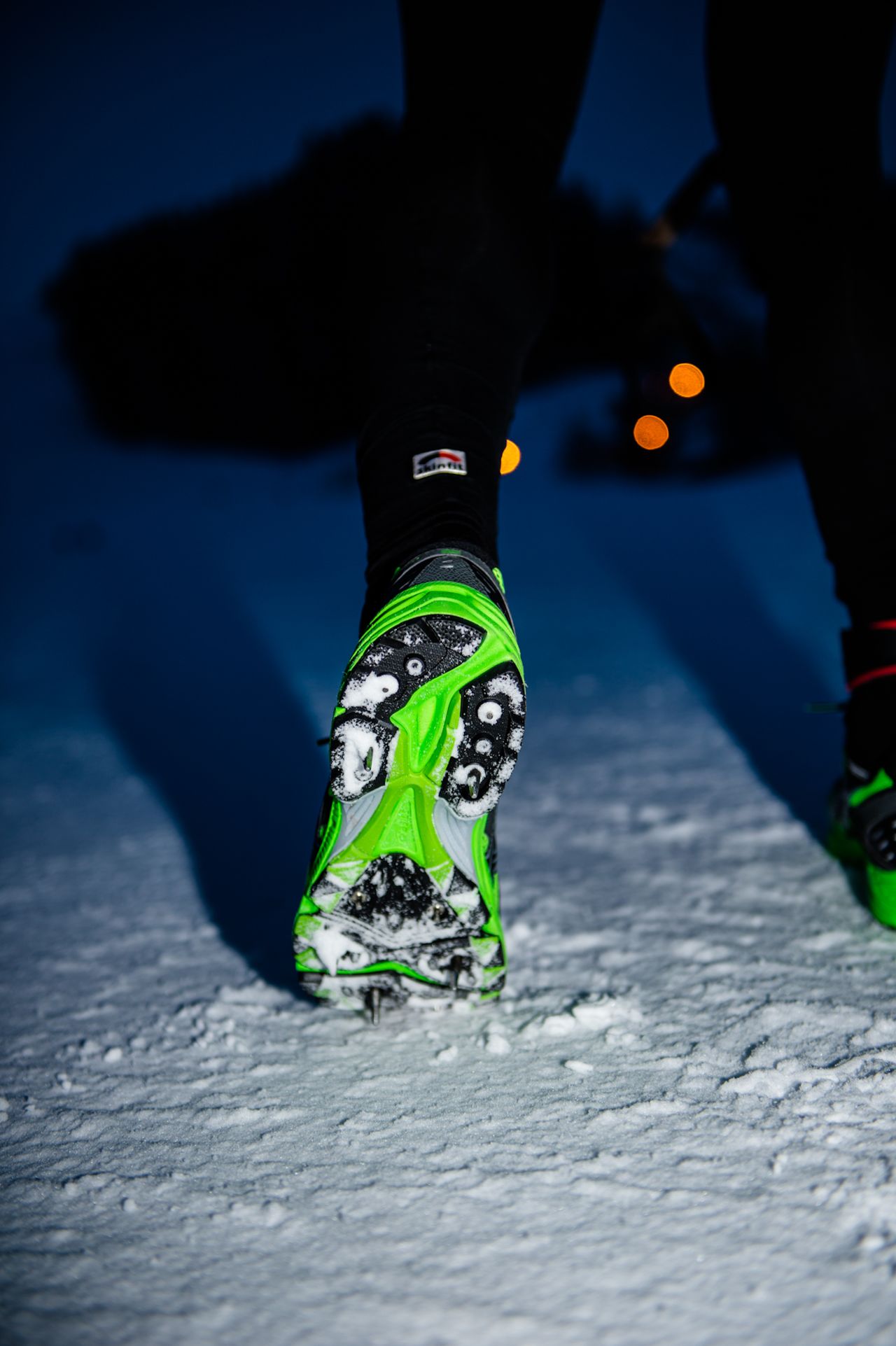 Most competitors wear spikes due to the icy conditions underfoot for the duration of the course. Others prefer to use cross-country skis.