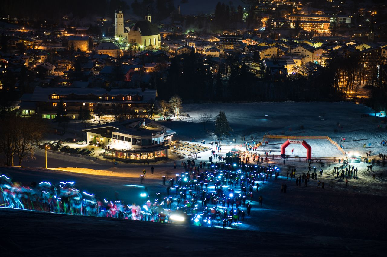 Competitors in their hundreds set off in a mass start for the Streif Vertical Up from Kitzbuhel, lighting up the snow with their head torches as they begin the tortuous climb to the top.