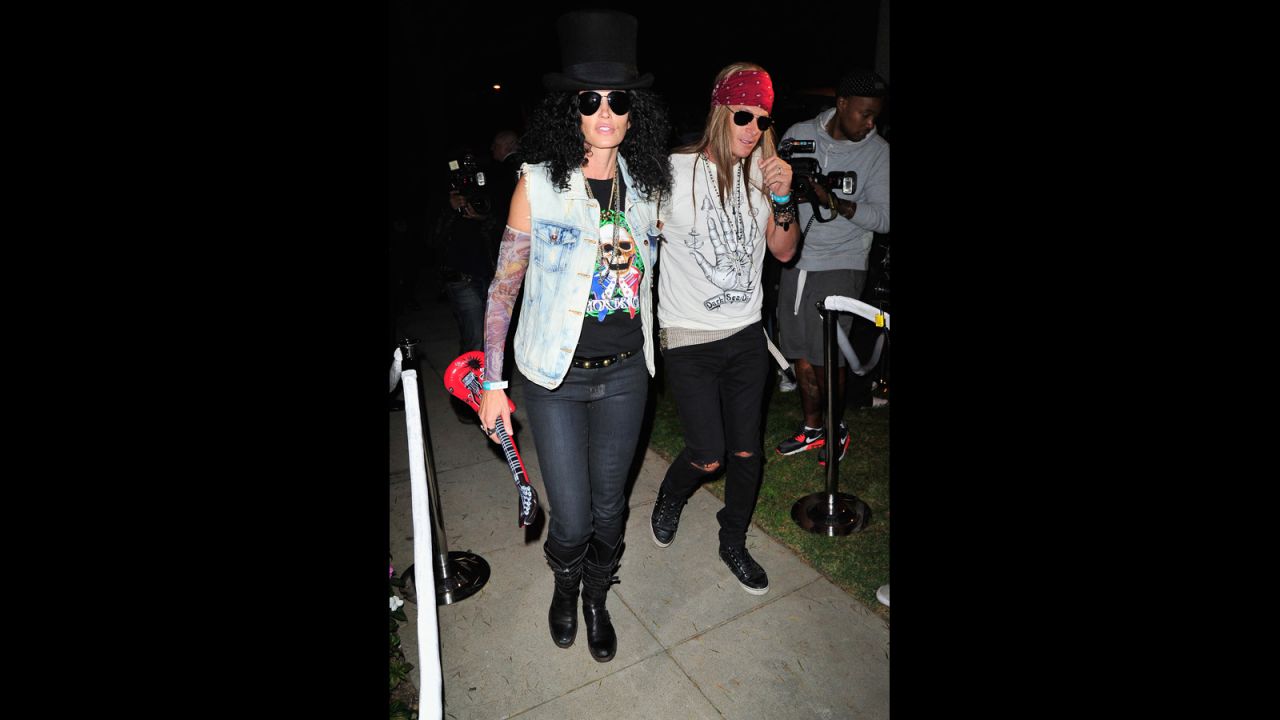 Cindy Crawford, left, and Rande Gerber grooved at an October 25 Halloween party as  Slash and Axl Rose.