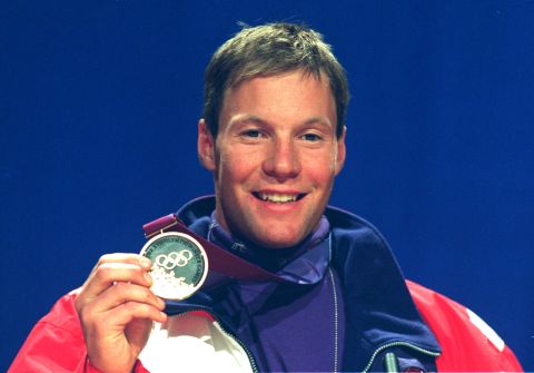 Men's downhill skiing winner Tommy Moe from the U.S. proudly shows off his gold. All the medals at the 1994 Winter Olympics incorporated stone extracted from the ski jump arena during construction. Lillehammer was known as the first "green" Games, enshrining now-familiar values of conservation and sustainability.  