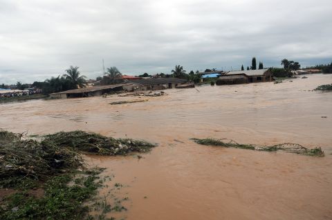 Floodwaters course through Odo Ona in Nigeria's Oyo State in 2011. At least 102 people were killed when a dam burst during torrential rain.