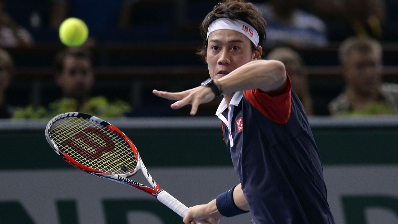 Japan's Kei Nishikori returns a shot to France's Julien Benneteau during their first round tennis match at the ninth and final ATP World Tour Masters 1000 indoor tournament on October 28, 2013 at the Bercy Palais-Omnisport (POPB) in Paris. AFP PHOTO / MIGUEL MEDINA (Photo credit should read MIGUEL MEDINA/AFP/Getty Images