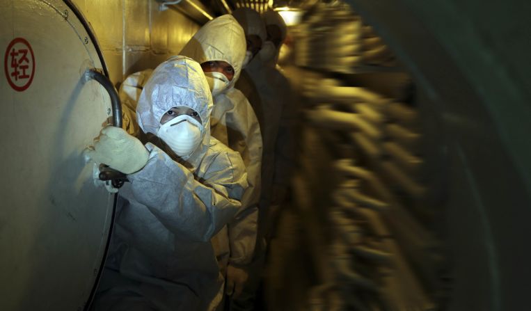 Soldiers walk past the submarine's nuclear reaction cabin at the Qingdao base in east China's Shandong province on September 3.