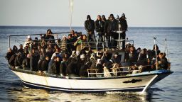 A boat full of immigrants is seen near the Italian island of Lampedusa on March 7, 2011.