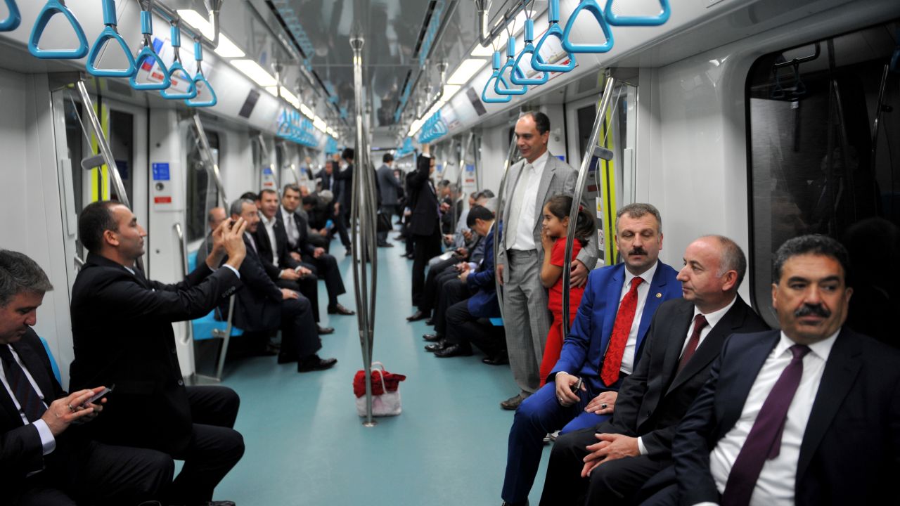 People travel from the Uskudar station to the Yenikapi station on the day of the tunnel's inauguration.
