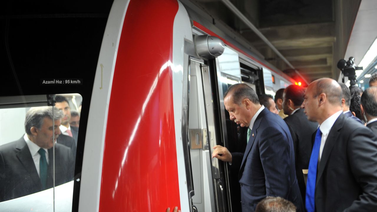 Erdogan enters the train's cabin along with other dignitaries. Erdogan said the underwater railway "connects history and future, past and the future, as well as connecting continents. Marmaray connects people, nations and countries."