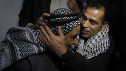 Palestinian prisoner Hazem Shubeir (R) hugs his father upon his arrival at his family home in Khan Younis in the southern Gaza Strip after his release from an Israeli jail, on October 30, 2013. Israel freed 26 veteran Palestinian prisoners in line with commitments to the US-backed peace process, but moved in tandem to ramp up settlement in annexed east Jerusalem. AFP PHOTO / SAID KHATIBSAID KHATIB/AFP/Getty Images