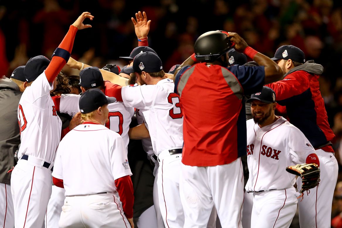 Boston Red Sox Koji Uehara celebrates winning World Series