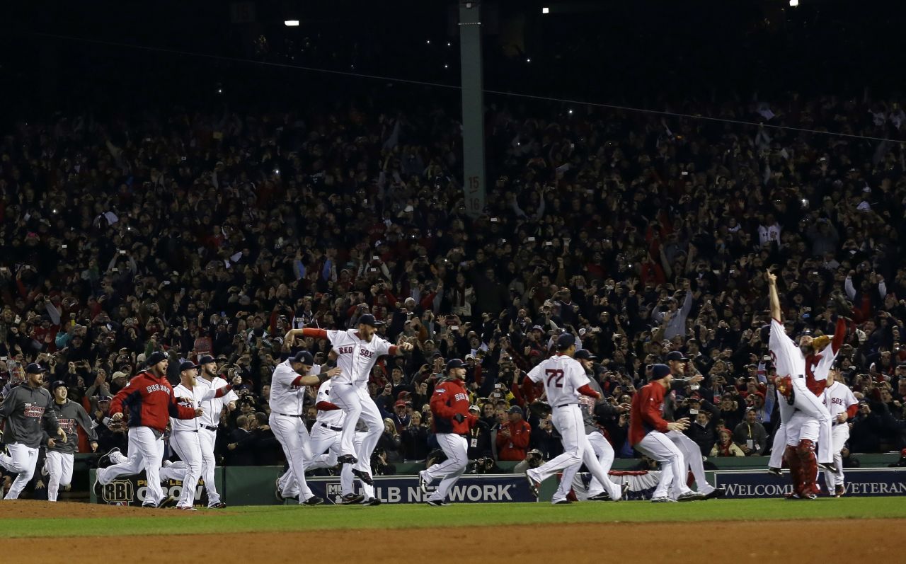 The Red Sox take to the field in celebration.