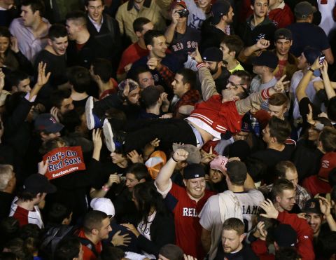Fans celebrate after the Red Sox take the series. 